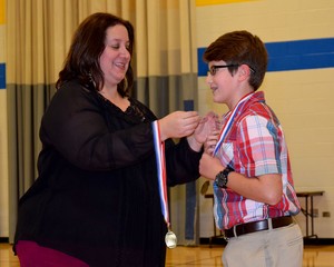 Student receiving a medal