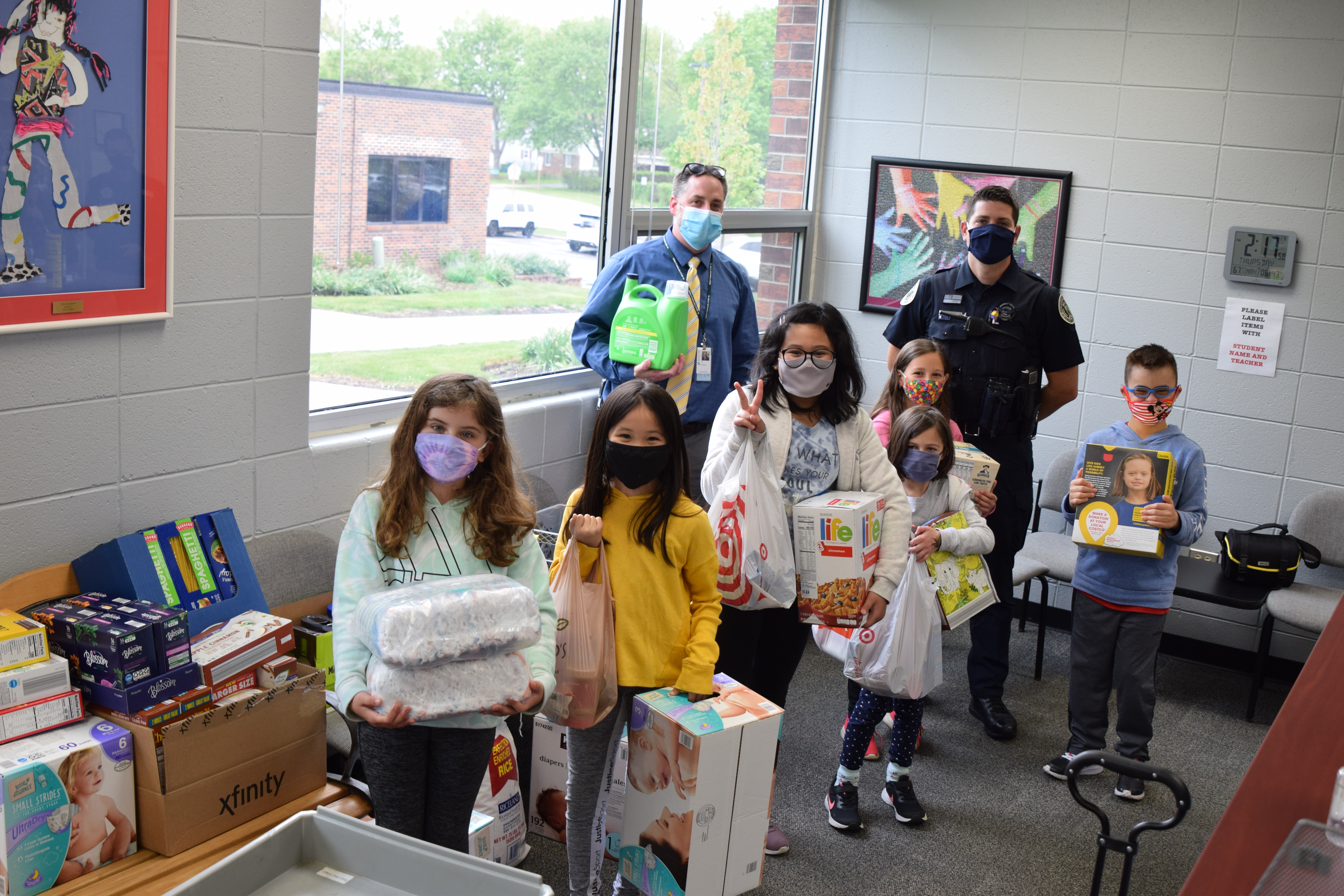 Ivy Hall Principal and students and Buffalo Grove Resource Office for "Stuff The Squad" food drive