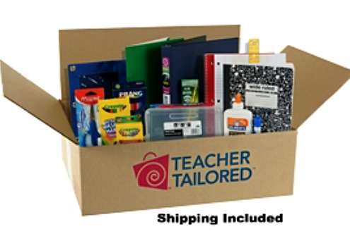 cardboard open box containing school supplies